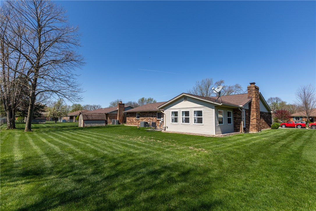 4210 Pleasanton Road Englewood, OH 45322 - Photo 29 of 34 This residence features a well-maintained yard and a welcoming exterior perfect for relaxation.