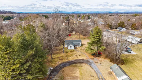 a view of swimming pool and mountain in the back