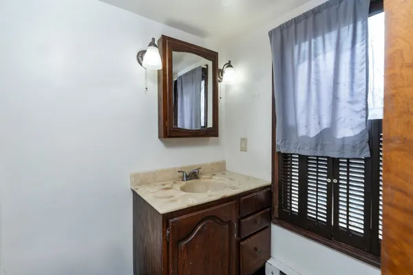 a view of a house with a yard and sitting area