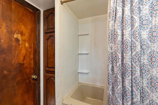 a view of a house with a yard covered in snow
