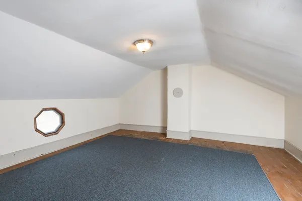 a view of a house with a patio and a yard