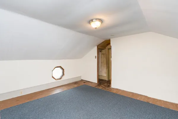 a front view of house with yard and trees