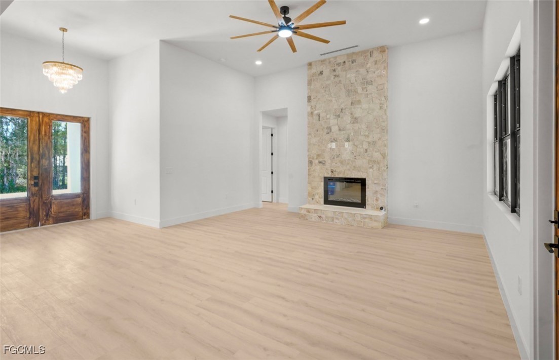 2310 Columbus Avenue Alva, FL 33920 - Photo 12 of 43 a view of an empty room with a fireplace and a window