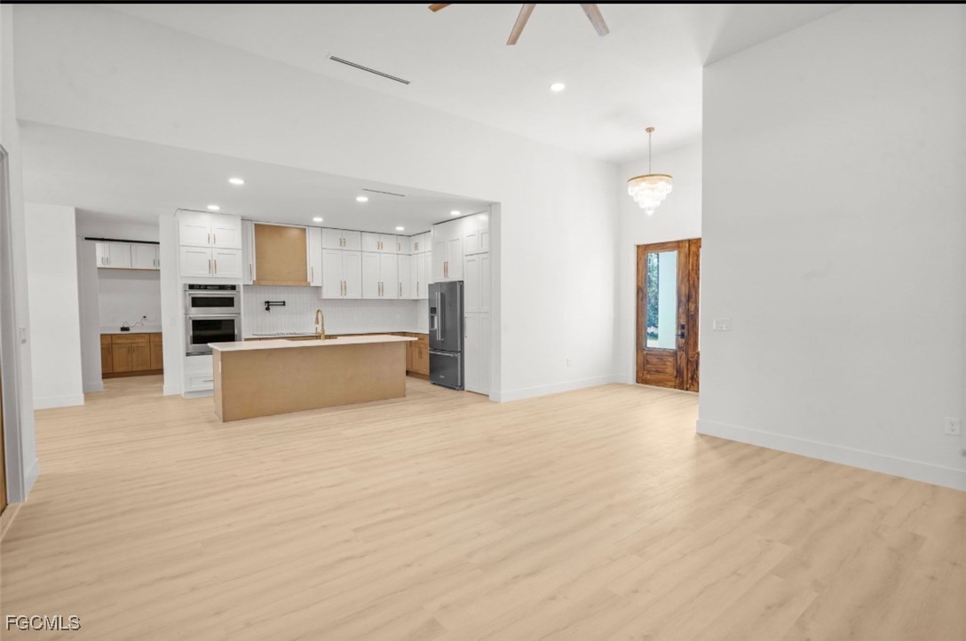 2310 Columbus Avenue Alva, FL 33920 - Photo 13 of 43 a view of a kitchen with a sink and a refrigerator