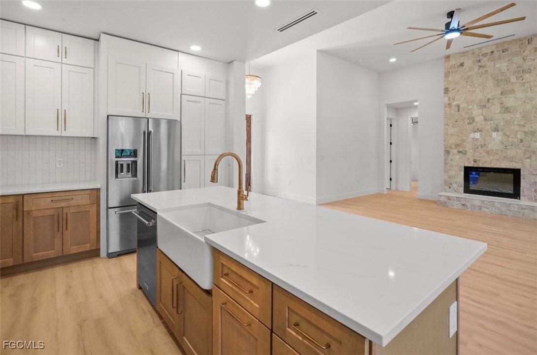2310 Columbus Avenue Alva, FL 33920 - Photo 19 of 43 a kitchen with stainless steel appliances granite countertop a sink a stove and a refrigerator
