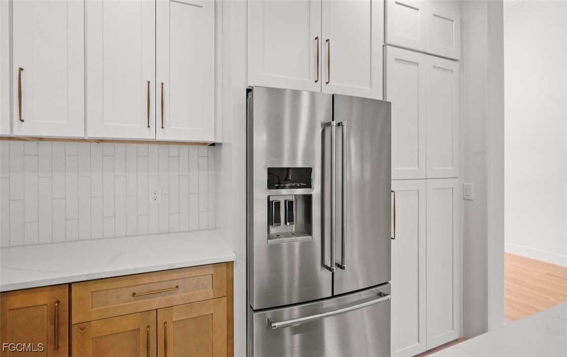 2310 Columbus Avenue Alva, FL 33920 - Photo 20 of 43 a metallic refrigerator freezer sitting in a kitchen