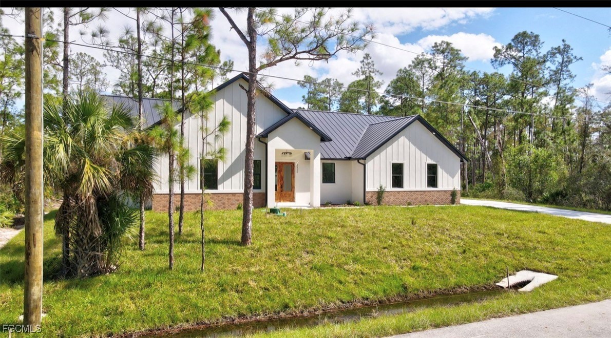 2310 Columbus Avenue Alva, FL 33920 - Photo 2 of 43 a view of a house with backyard