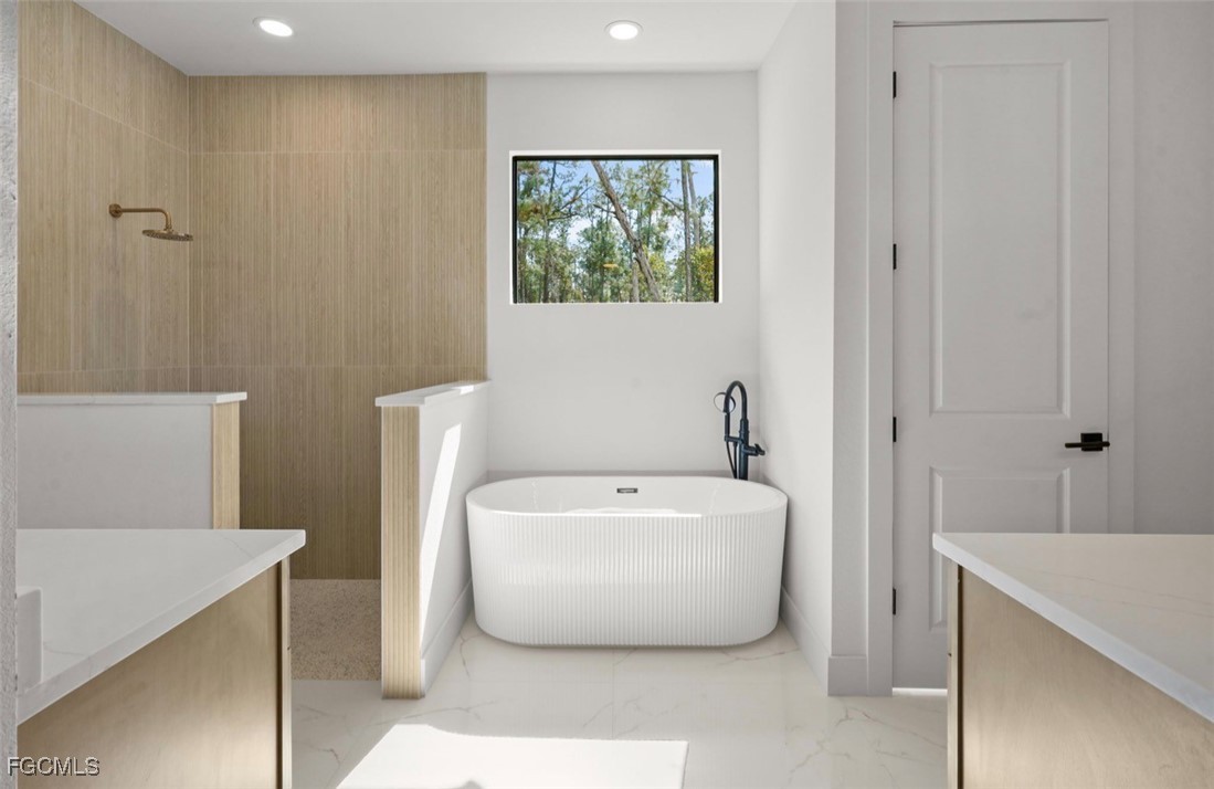 2310 Columbus Avenue Alva, FL 33920 - Photo 26 of 43 a white bath tub sitting in a bathroom