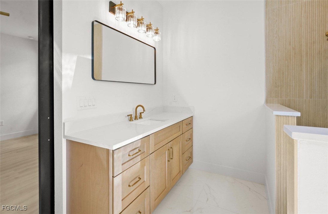 2310 Columbus Avenue Alva, FL 33920 - Photo 27 of 43 a bathroom with a sink a mirror and vanity