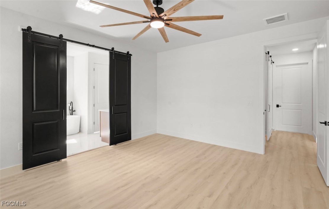 2310 Columbus Avenue Alva, FL 33920 - Photo 30 of 43 a view of a big room with closet and a chandelier fan