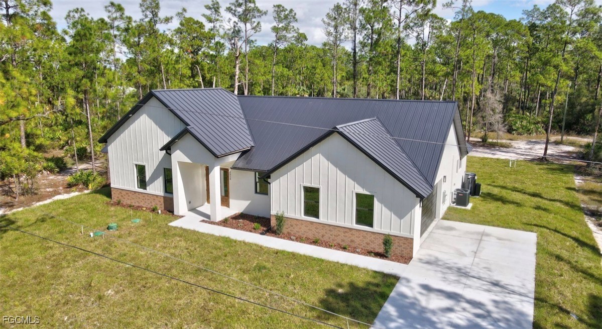 2310 Columbus Avenue Alva, FL 33920 - Photo 3 of 43 a view of house and yard with green space