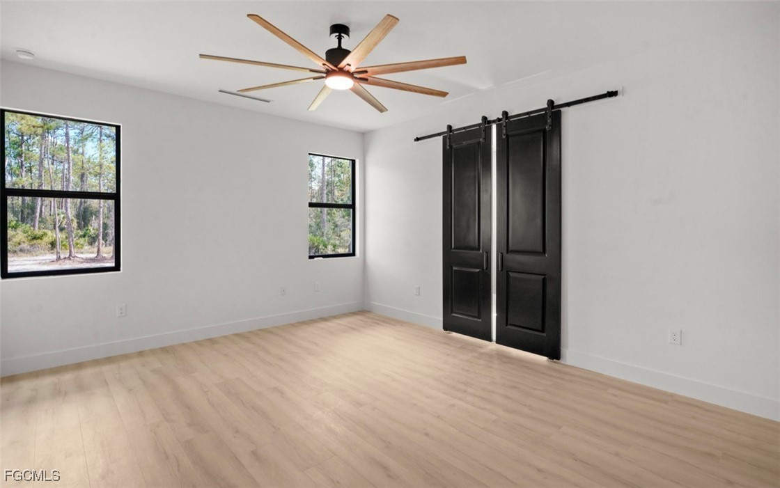 2310 Columbus Avenue Alva, FL 33920 - Photo 32 of 43 an empty room with windows and fan