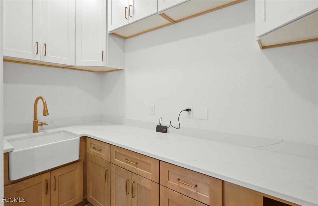 2310 Columbus Avenue Alva, FL 33920 - Photo 34 of 43 a kitchen with a sink and cabinets