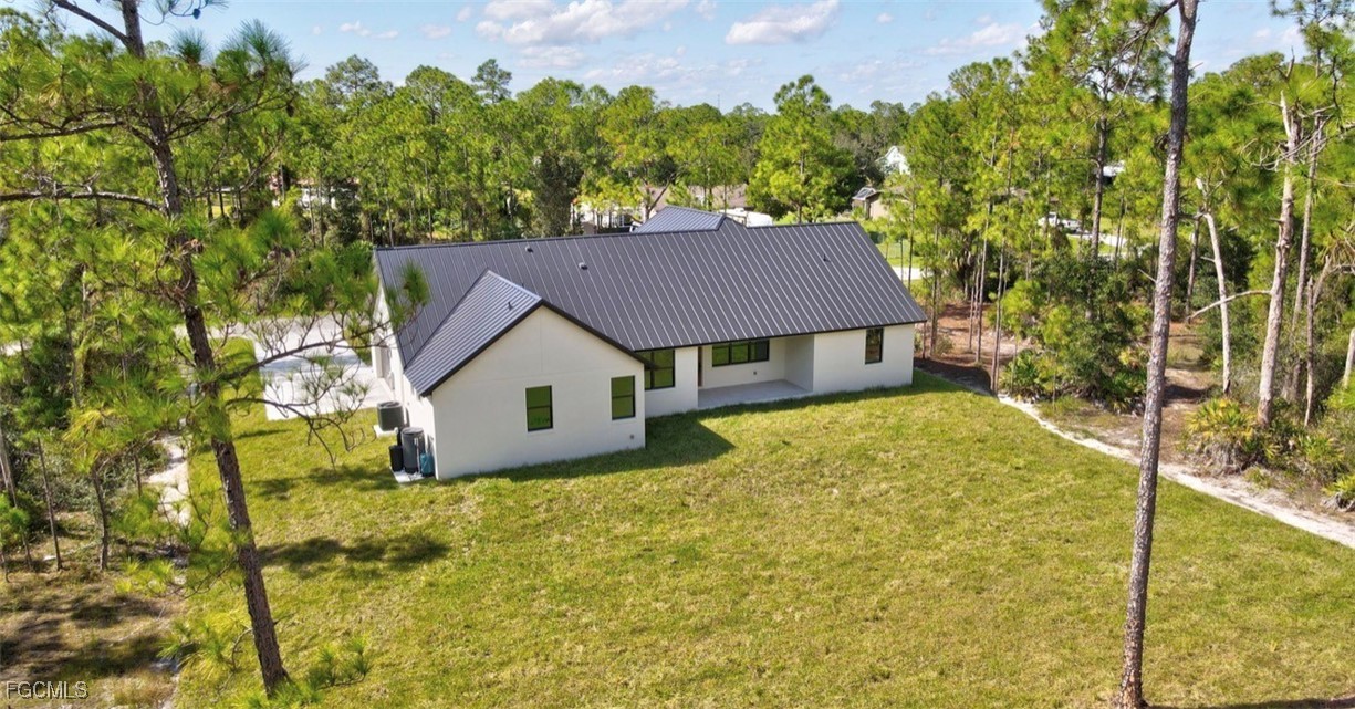 2310 Columbus Avenue Alva, FL 33920 - Photo 4 of 43 a house is sitting in middle of the garden
