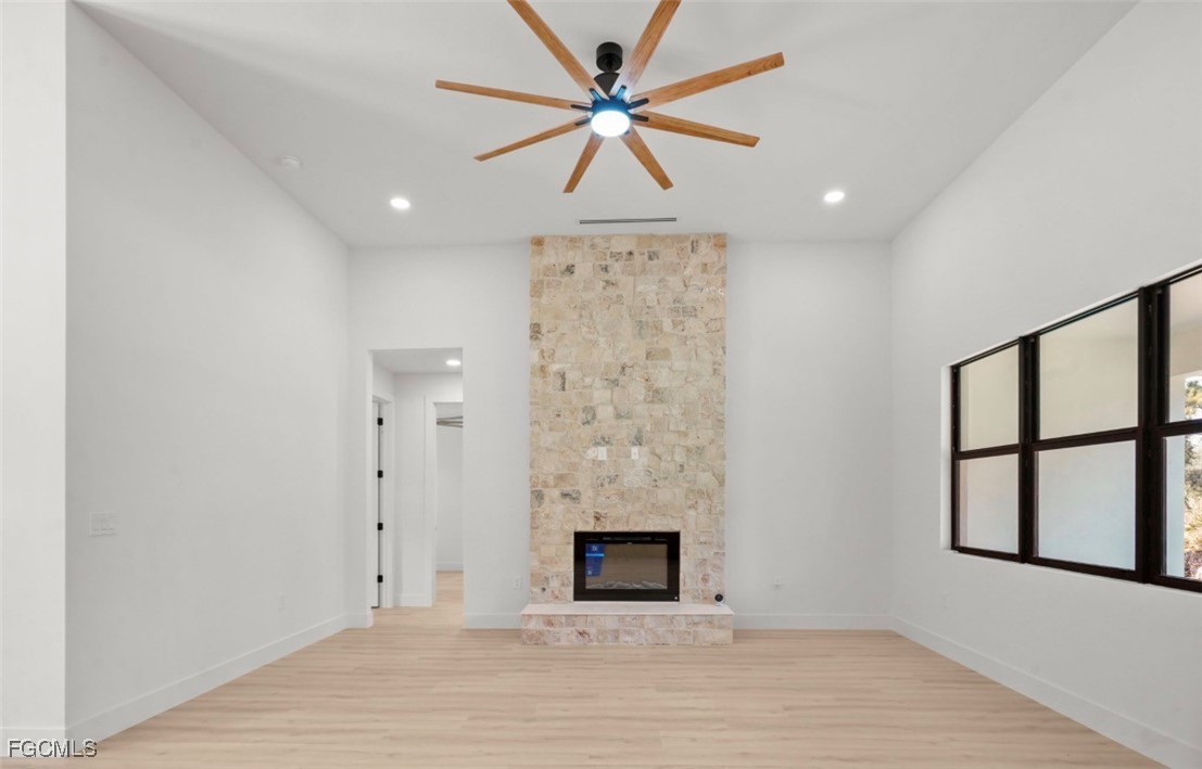 2310 Columbus Avenue Alva, FL 33920 - Photo 10 of 43 an empty room with windows and ceiling fan