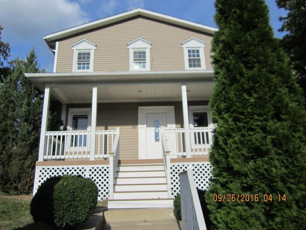 a front view of a house with a porch