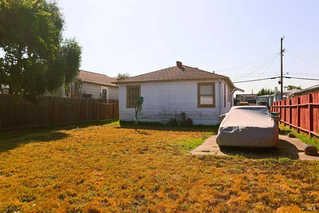 a front view of a house with wooden fence