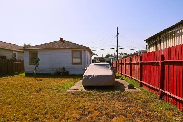 a view of a house with a flower garden