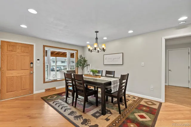 a dining room with furniture and window