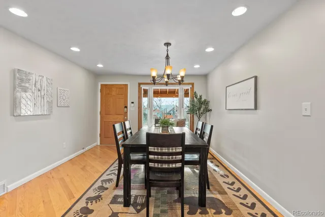 a large kitchen with stainless steel appliances granite countertop a refrigerator a stove and a sink