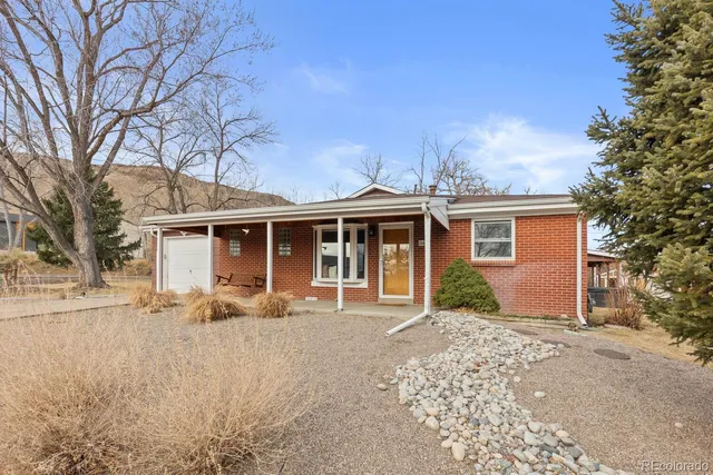 a view of a house with a snow in the yard