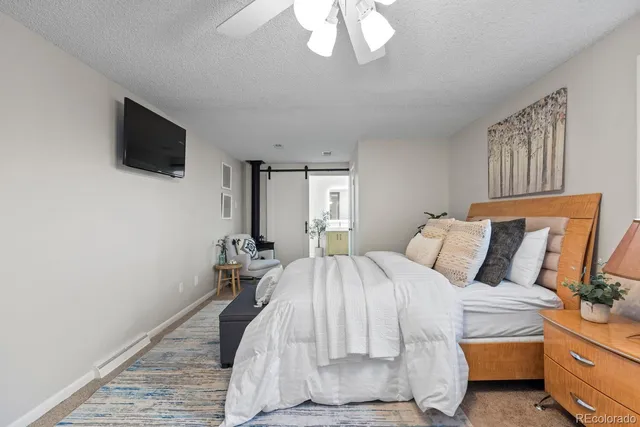 a bedroom with a bed and a table