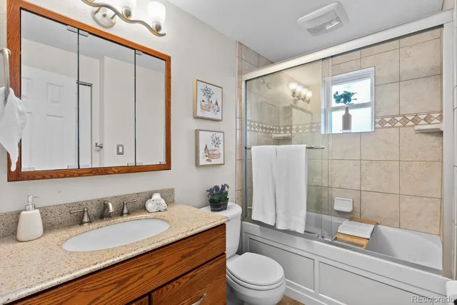 a living room with furniture a dining table and a fireplace