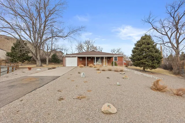 a view of a patio with table and chairs and potted plants