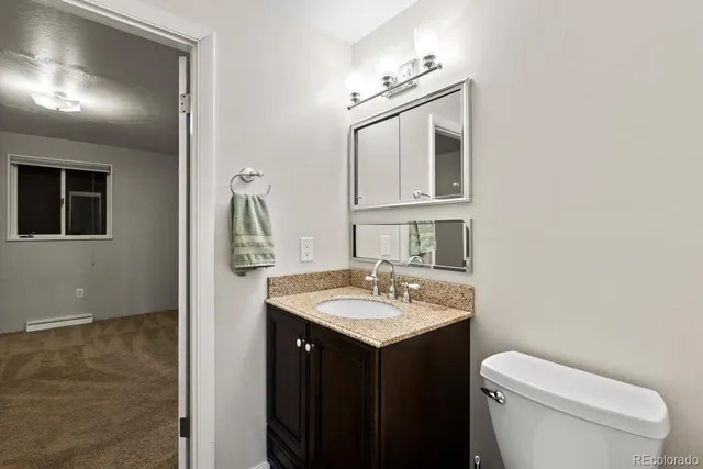 front view of a house with large trees