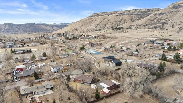 a kitchen with stainless steel appliances a refrigerator sink and wooden cabinets