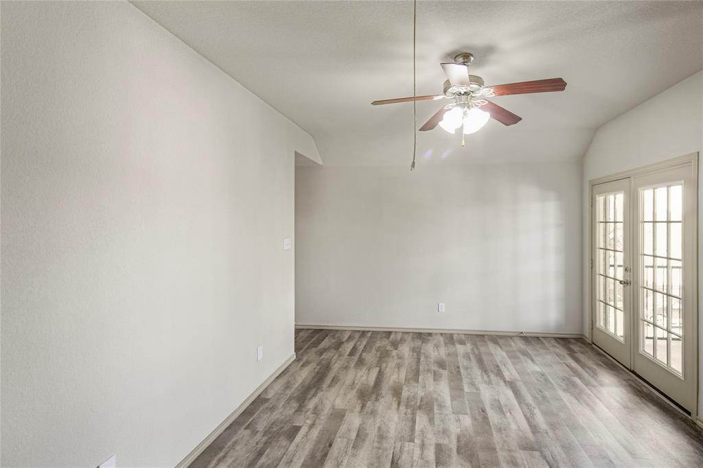 10033 Butte Meadows Drive Fort Worth, TX 76177 - Photo 18 of 31 wooden floor in an empty room with a window