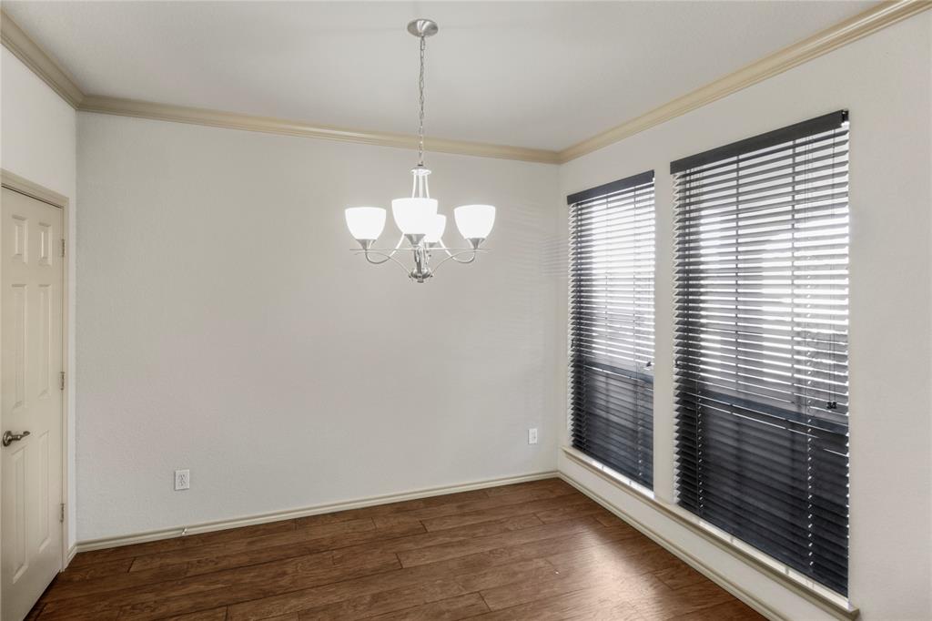 10033 Butte Meadows Drive Fort Worth, TX 76177 - Photo 9 of 31 an empty room with wooden floor and windows