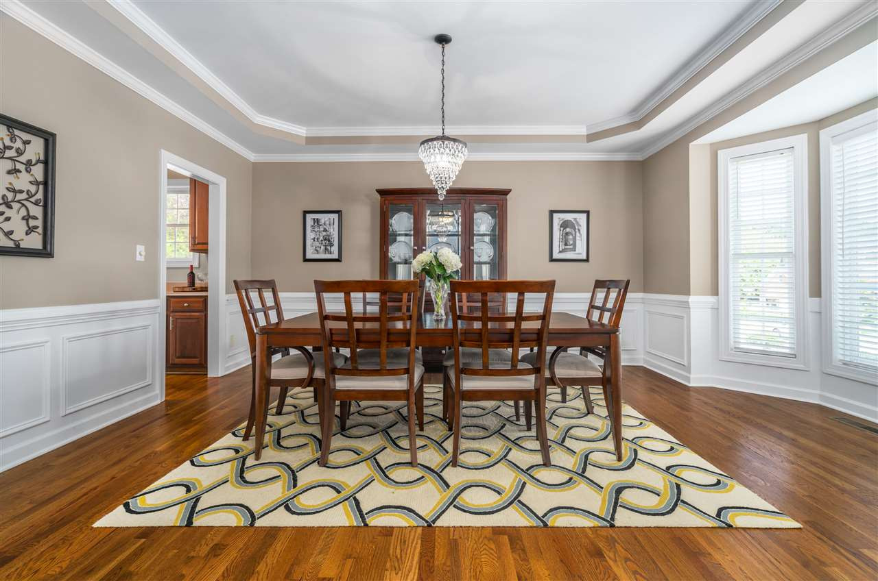 1520 Wood Spring Court Raleigh, NC 27614 - Photo 7 of 30 Formal dining room with tray ceiling and gorgeous decorative trim details, bay window and lots of natural light. Site finished hardwood floors Dining Room