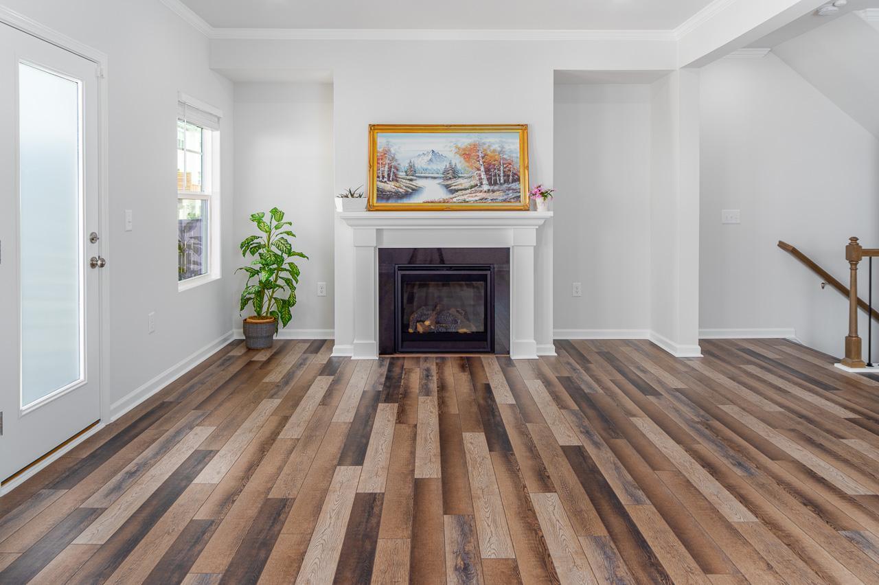 1434 Rosepine Drive Cary, NC 27519 - Photo 12 of 32 wooden floor fireplace and windows in a room