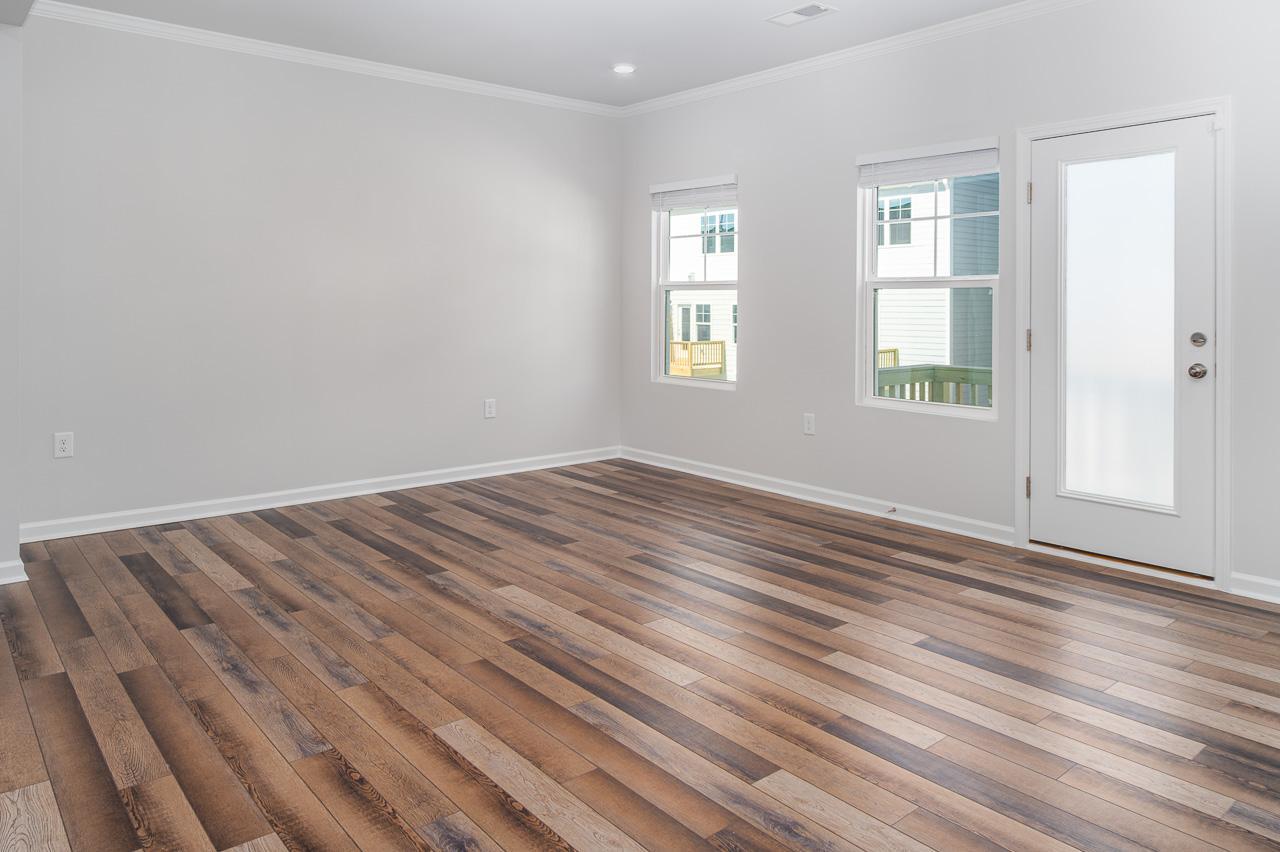 1434 Rosepine Drive Cary, NC 27519 - Photo 14 of 32 an empty room with wooden floor and windows