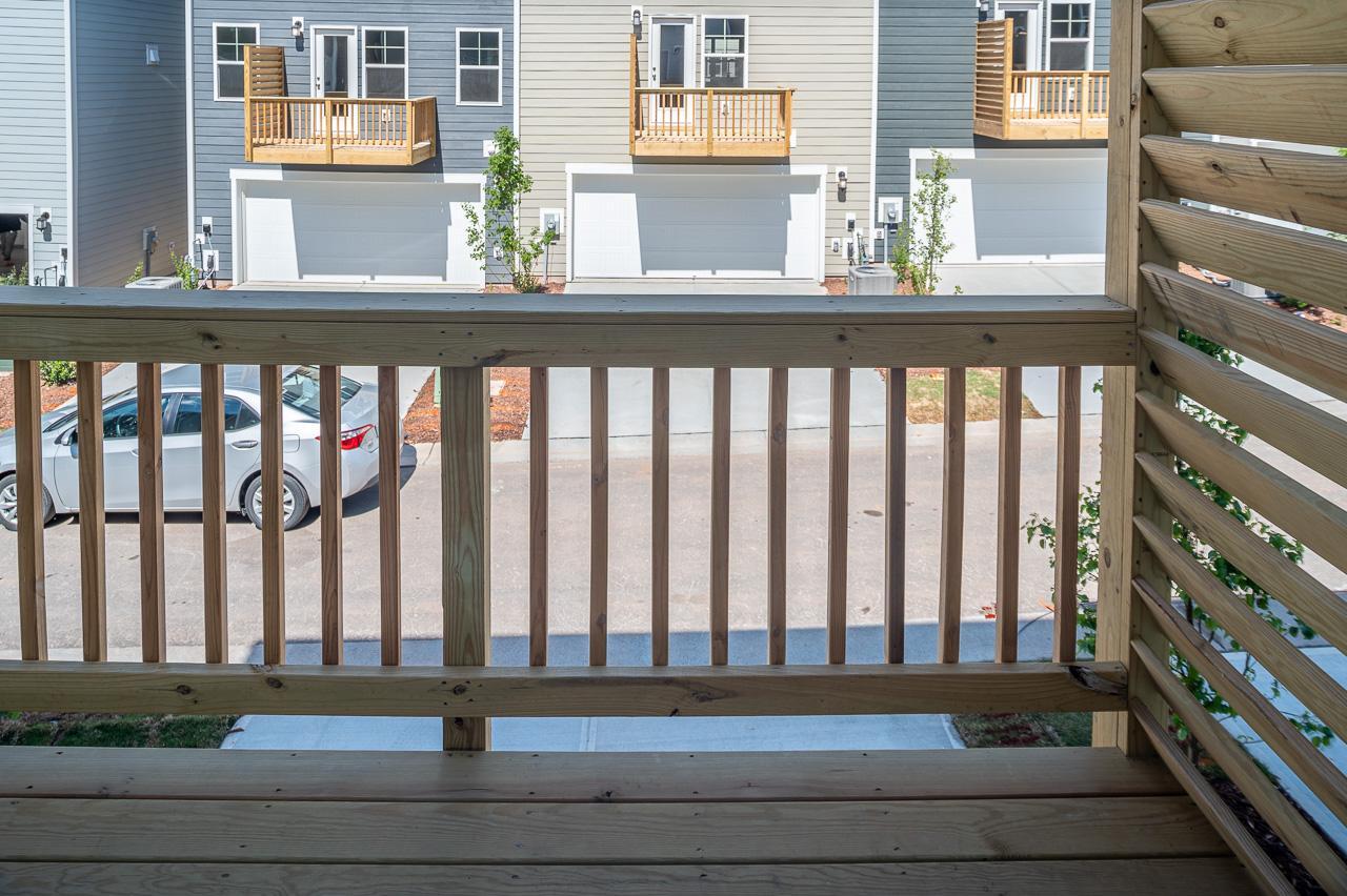 1434 Rosepine Drive Cary, NC 27519 - Photo 17 of 32 a view of a porch with a bench