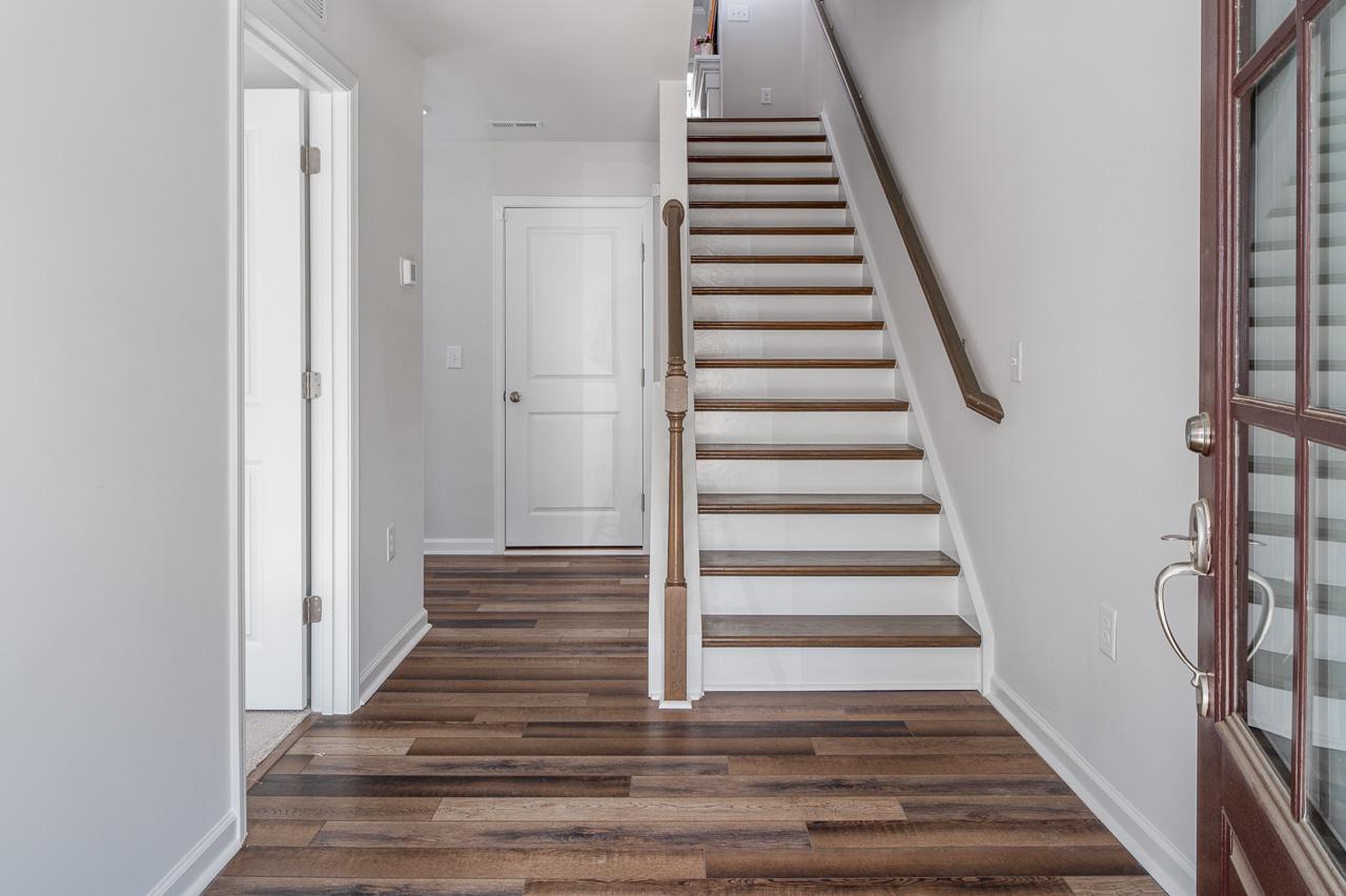 1434 Rosepine Drive Cary, NC 27519 - Photo 6 of 32 a view of a hallway with wooden floor and entryway