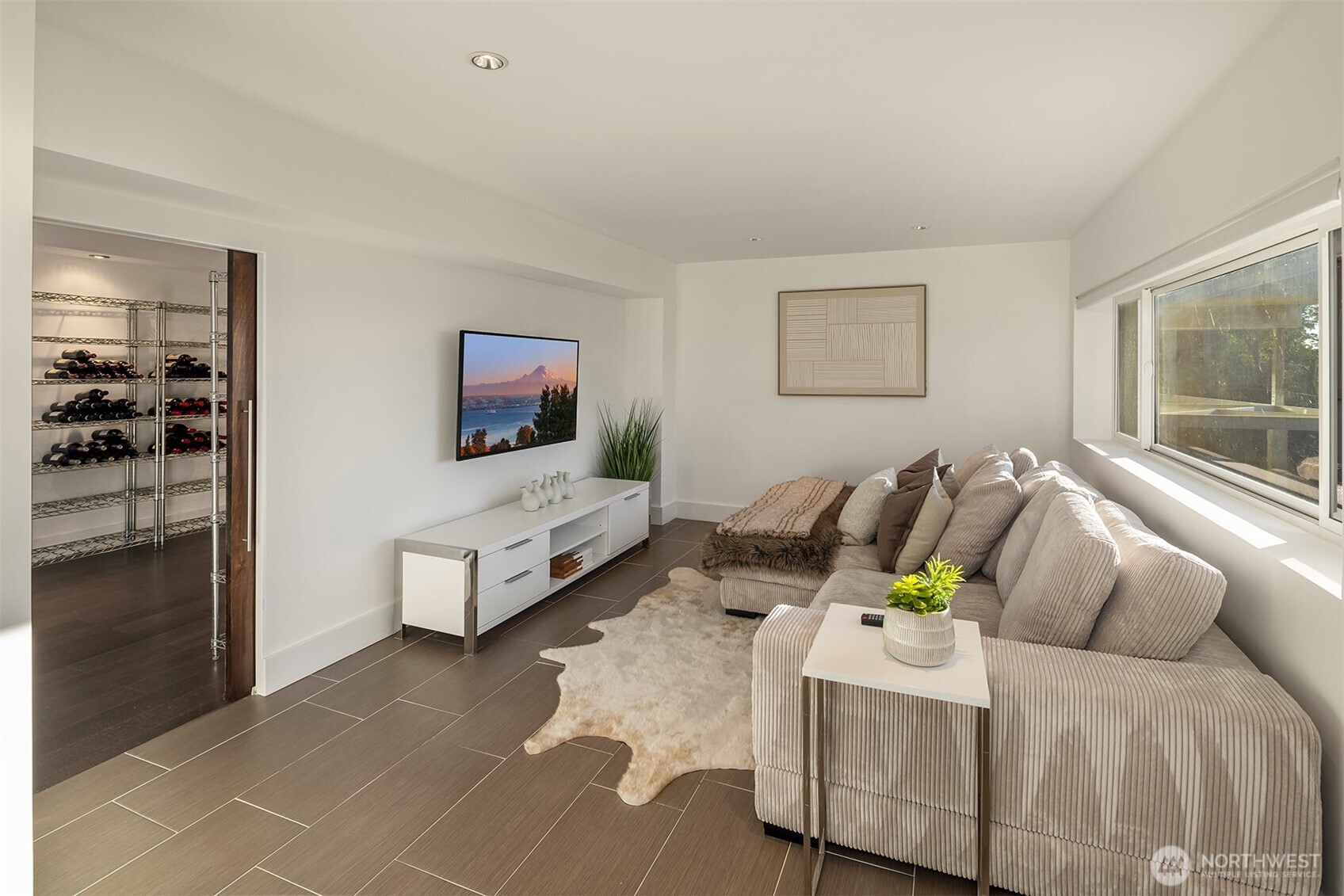 15733 25th Avenue Southwest Burien, WA 98166 - Photo 18 of 38 a living room with furniture and a flat screen tv