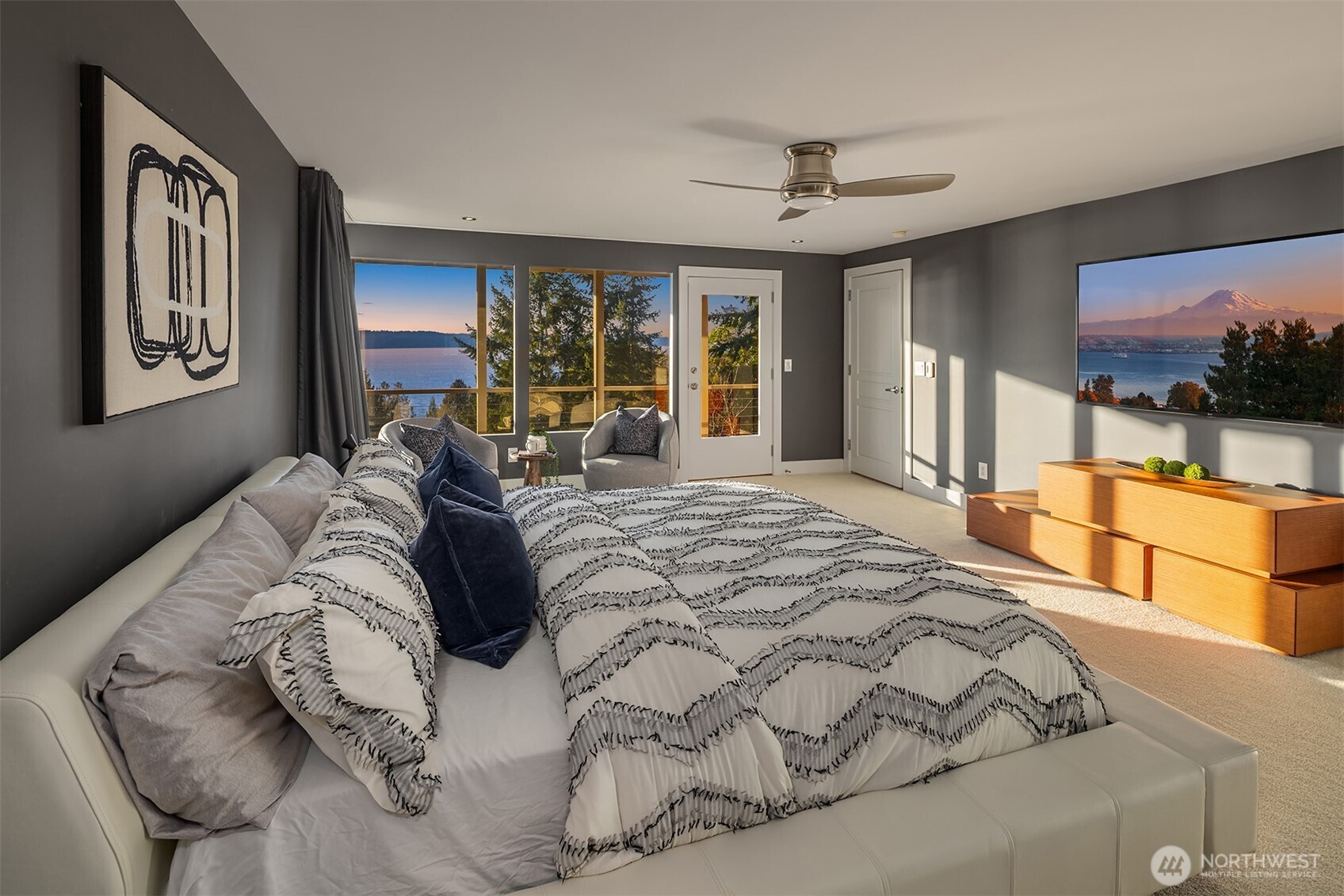 15733 25th Avenue Southwest Burien, WA 98166 - Photo 21 of 38 a bedroom with a large bed and a flat tv screen on dresser