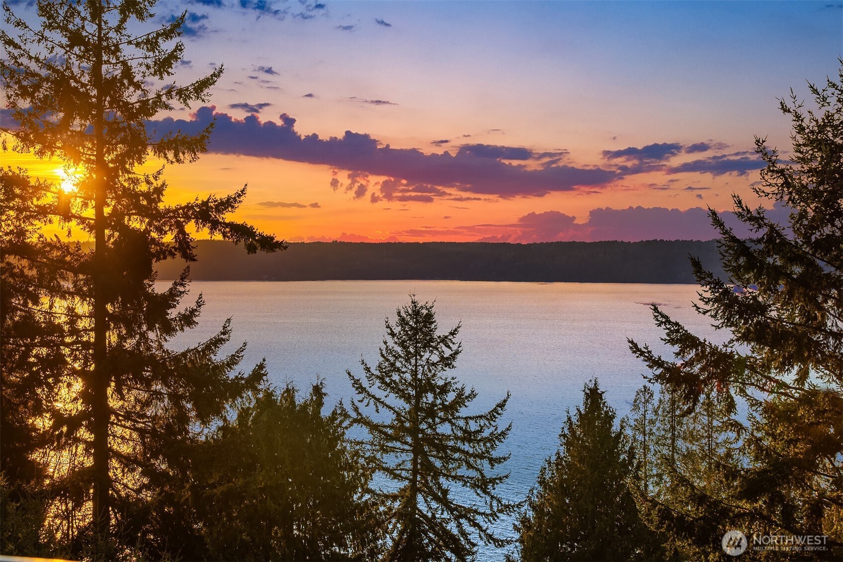 15733 25th Avenue Southwest Burien, WA 98166 - Photo 32 of 38 a view of lake with sunset in background