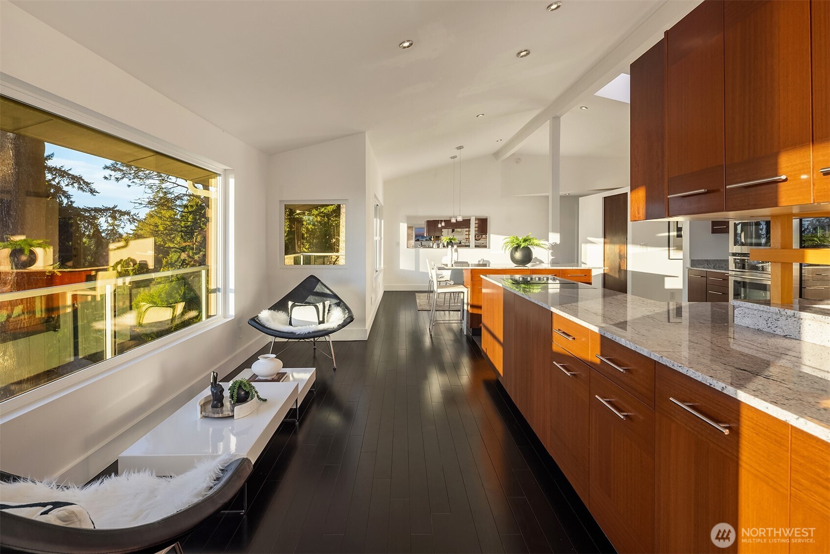 15733 25th Avenue Southwest Burien, WA 98166 - Photo 9 of 38 a dining hall with stainless steel appliances kitchen island granite countertop a large kitchen counter top a stove and a sink with couches