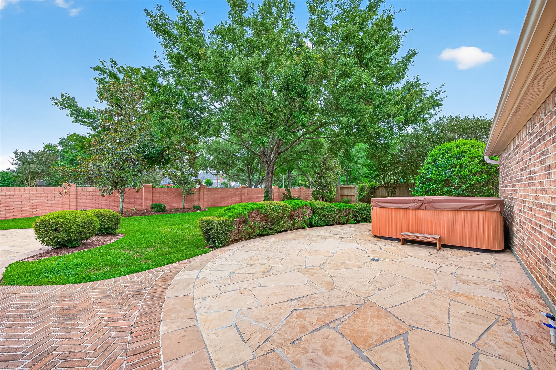 4203 Deforest Ridge Circle Katy, TX 77494 - Photo 46 of 50 Relax and unwind in the private freestanding 7-person spa — the perfect retreat for entertaining guests or enjoying peaceful evenings under the stars