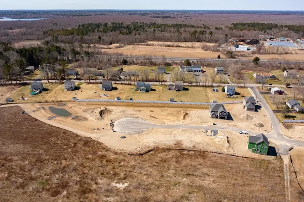 an aerial view of residential building and parking space