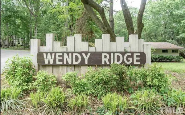 a view of front of a house with a garden