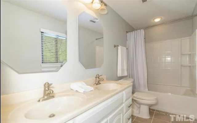 a bathroom with a granite countertop sink toilet a large mirror and shower