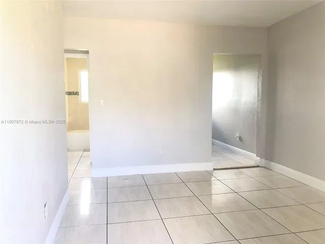 an empty room with a bathroom