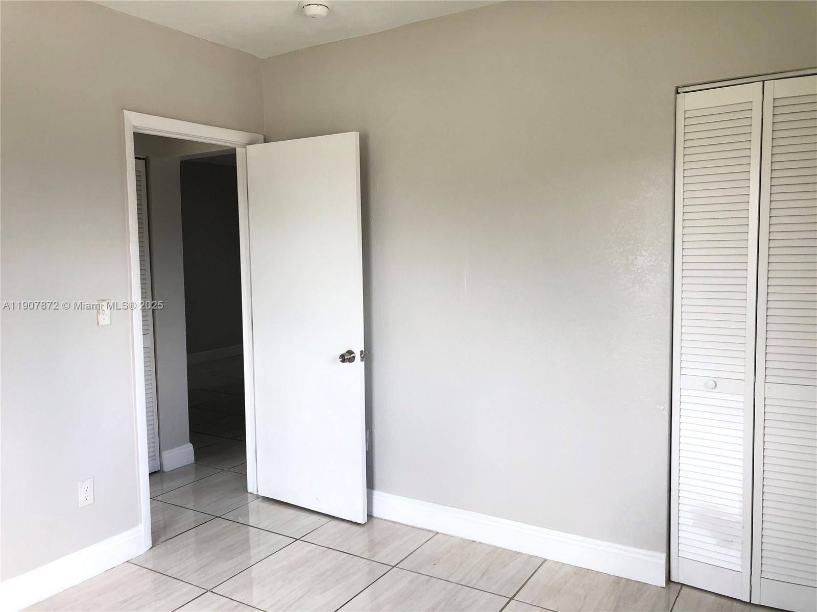 1940 Washington Avenue, Unit 11 Opa-Locka, FL 33054 - Photo 6 of 14 a view of an empty room