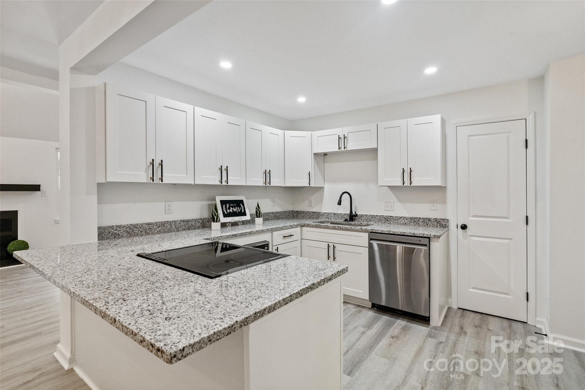 9514 Fairway Ridge Road Charlotte, NC 28277 - Photo 13 of 36 a kitchen with stainless steel appliances granite countertop a sink stove and cabinets