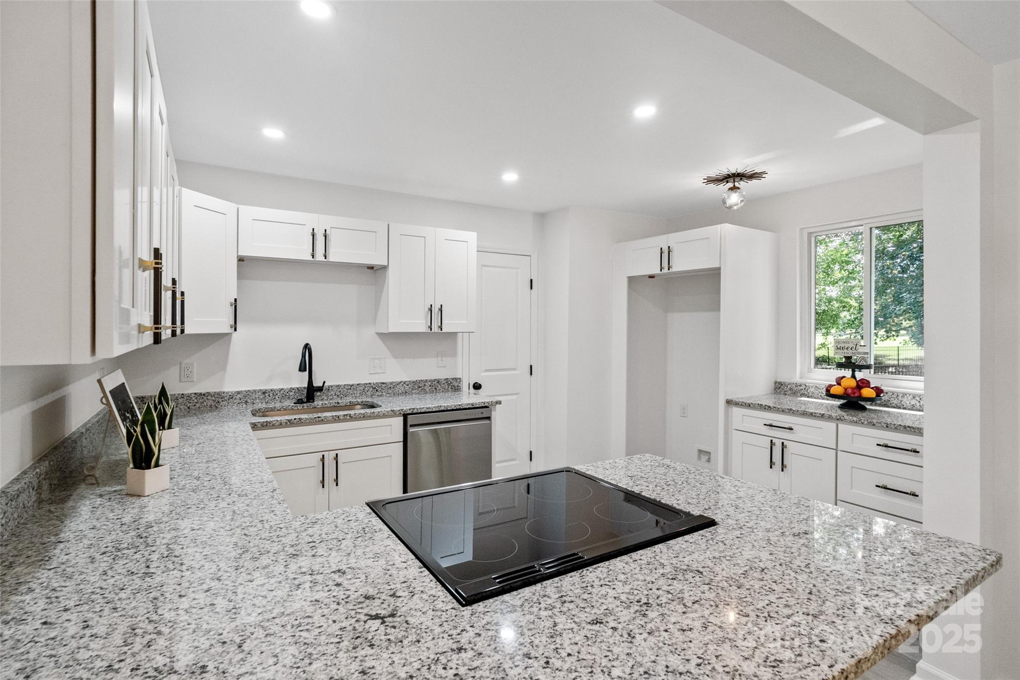 9514 Fairway Ridge Road Charlotte, NC 28277 - Photo 14 of 36 a kitchen with stainless steel appliances granite countertop a sink stove and refrigerator