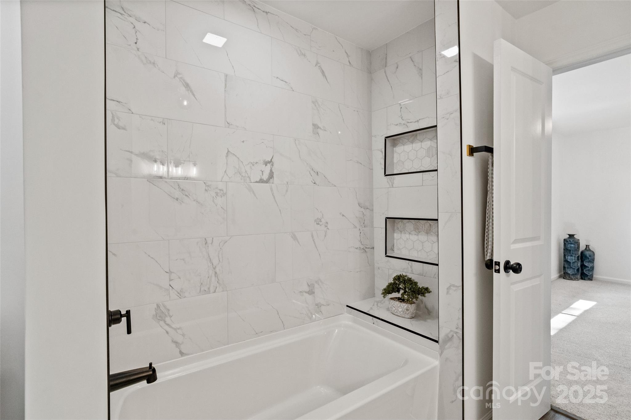 9514 Fairway Ridge Road Charlotte, NC 28277 - Photo 25 of 36 a bathroom with a bathtub and a shower